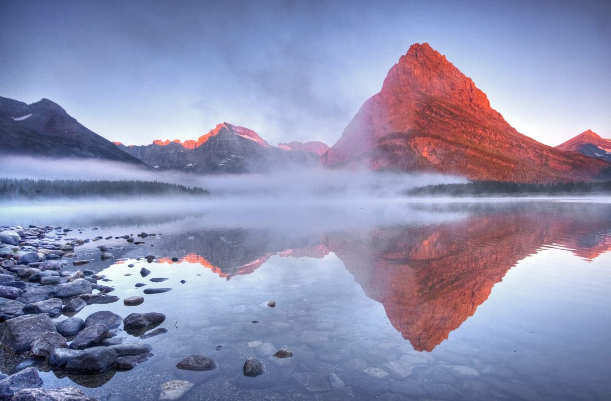 Grinnell Point in Glacier National Park highlighted by an eerily-red light.