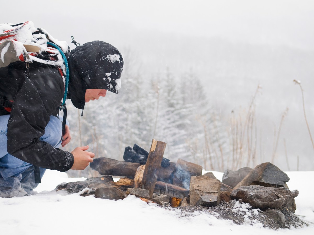 A woman hiking on a winter day starts a fire outside a shelter on the Appalachian Trail in Carter County, Tennessee