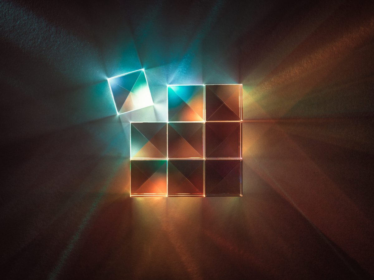 X-Cube Prism with Multi-colored X-shaped Light Beams Spectrum.