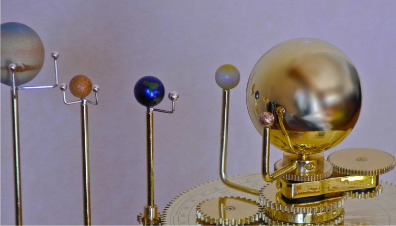 An orrery, or mechanical model of the solar system. Via Wikimedia Commons.