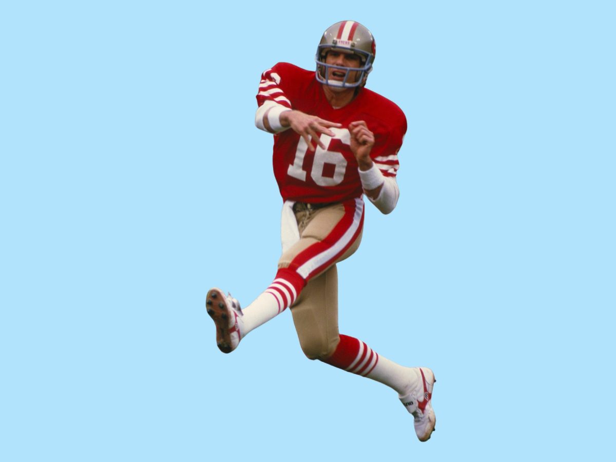 Football quarterback Joe Montana captured in motion, just having released the ball. Set against a pale blue background.