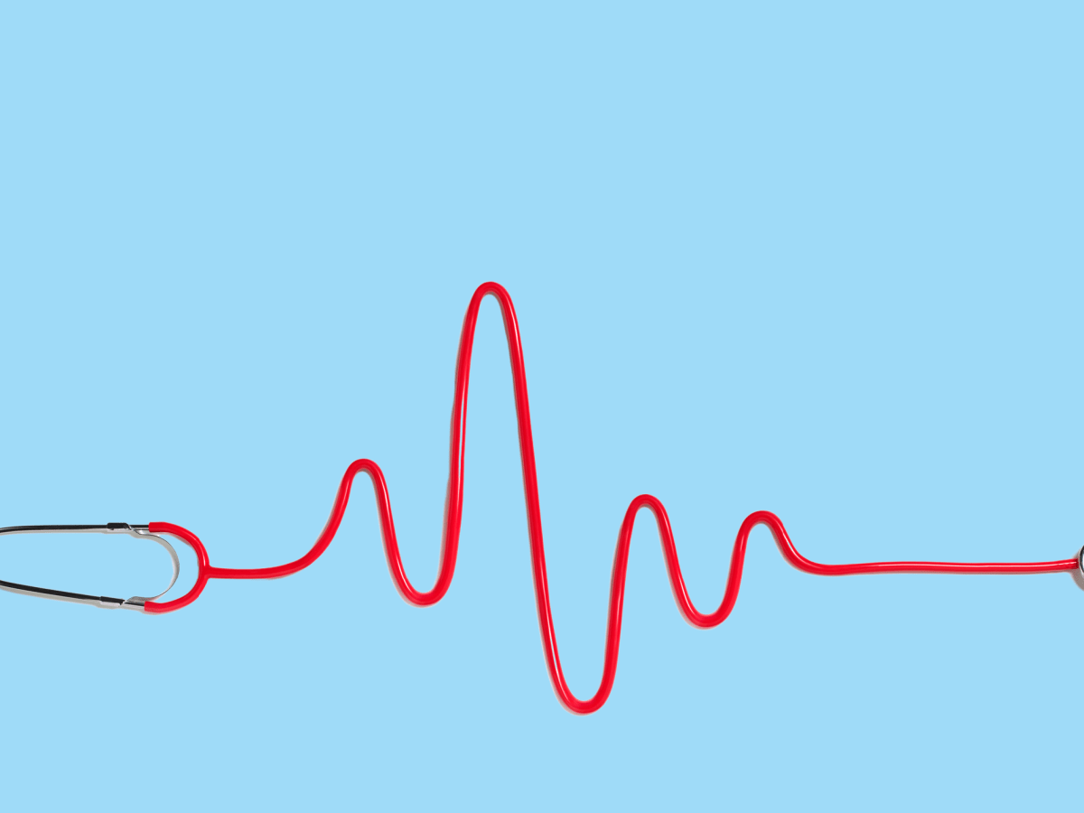 Illustration of a red stethoscope shaped as a heart rate display, against a plain light blue background