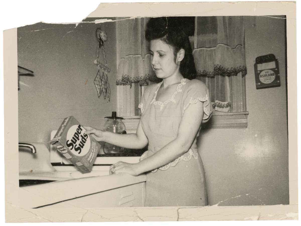 analog photograph of woman holding laundry detergent