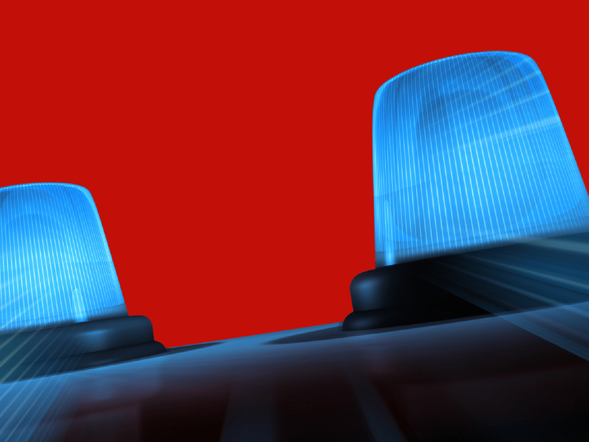 An illustration of flashing blue lights against a bright red background.